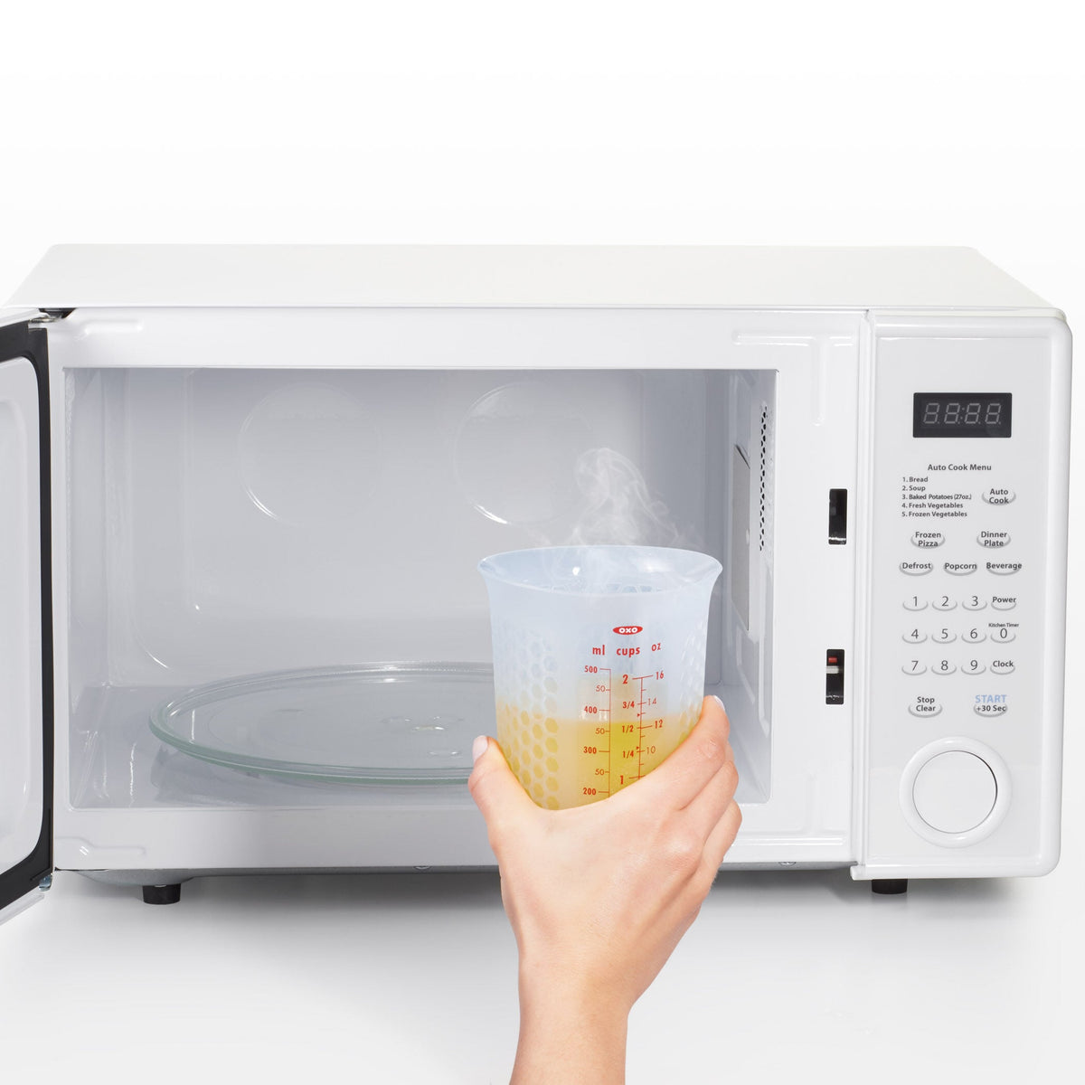2-cup-squeeze-and-pour-silicone-measuring-cup-y1 oxo_good_grips_silicone_measuring_cup_-_in_microwave.jpg